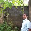 Pastor Nanayakkara inside the crumbling shell that was transformed into a classroom.